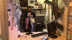 A small office with a desk, computer, and a map. - Astor Kensington Hostel (London)