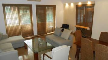 Suite, 3 Bedrooms, Ocean View | Living room | 36-inch LCD TV with cable channels, TV, pay movies