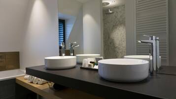Deluxe Room | Bathroom | Designer toiletries, hair dryer, towels, soap