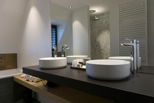 Deluxe Room | Bathroom | Designer toiletries, hair dryer, towels, soap