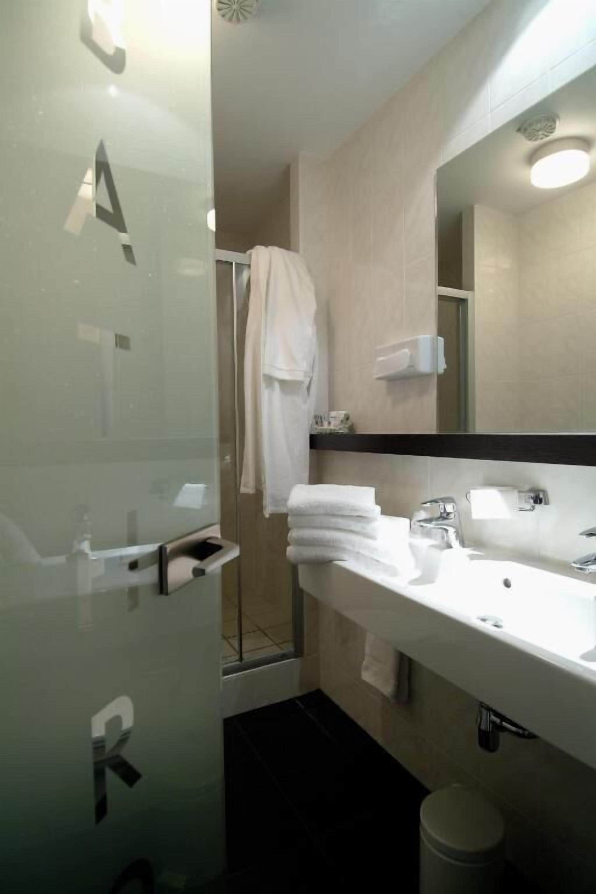 designer toiletries, hair dryer, towels, soap