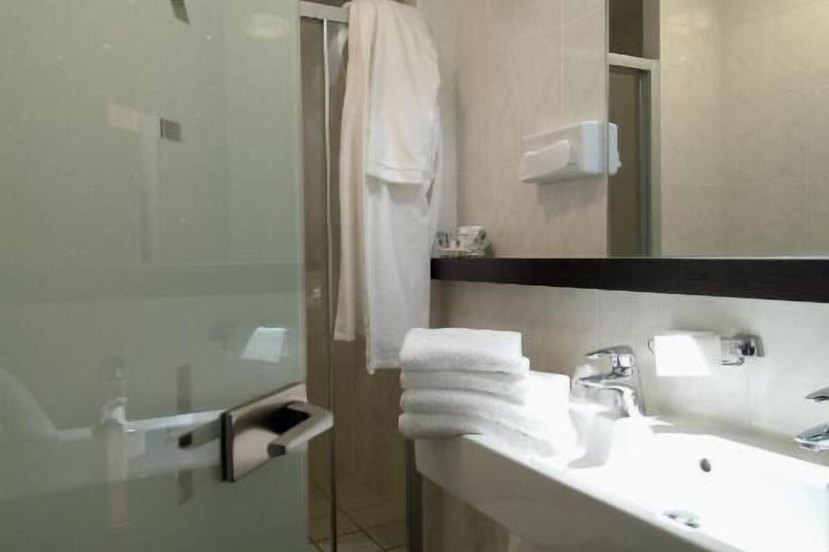 designer toiletries, hair dryer, towels, soap