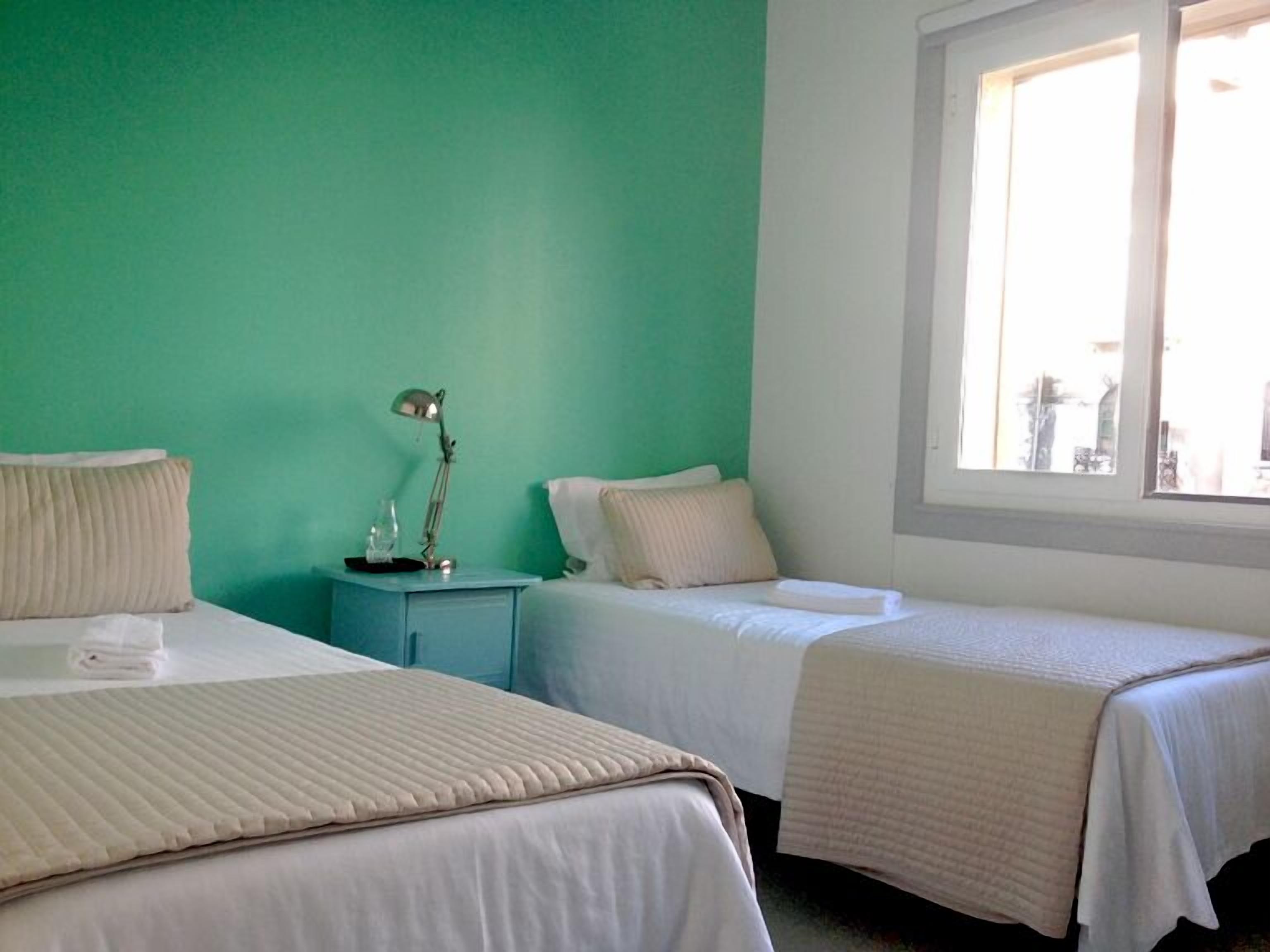 Double or Twin Room | Blackout drapes, iron/ironing board, cribs (free), WiFi (free)