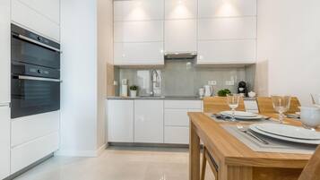 Apartment, 1 Bedroom (with A/C - at 1 Zeromskiego Street) | Private kitchen | Fridge, stovetop, electric kettle, toaster