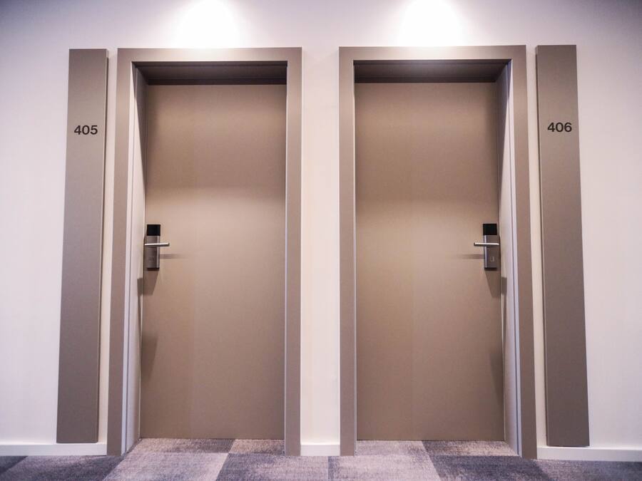Two closed doors with numbers 405 and 406, indicating a hotel or office building.