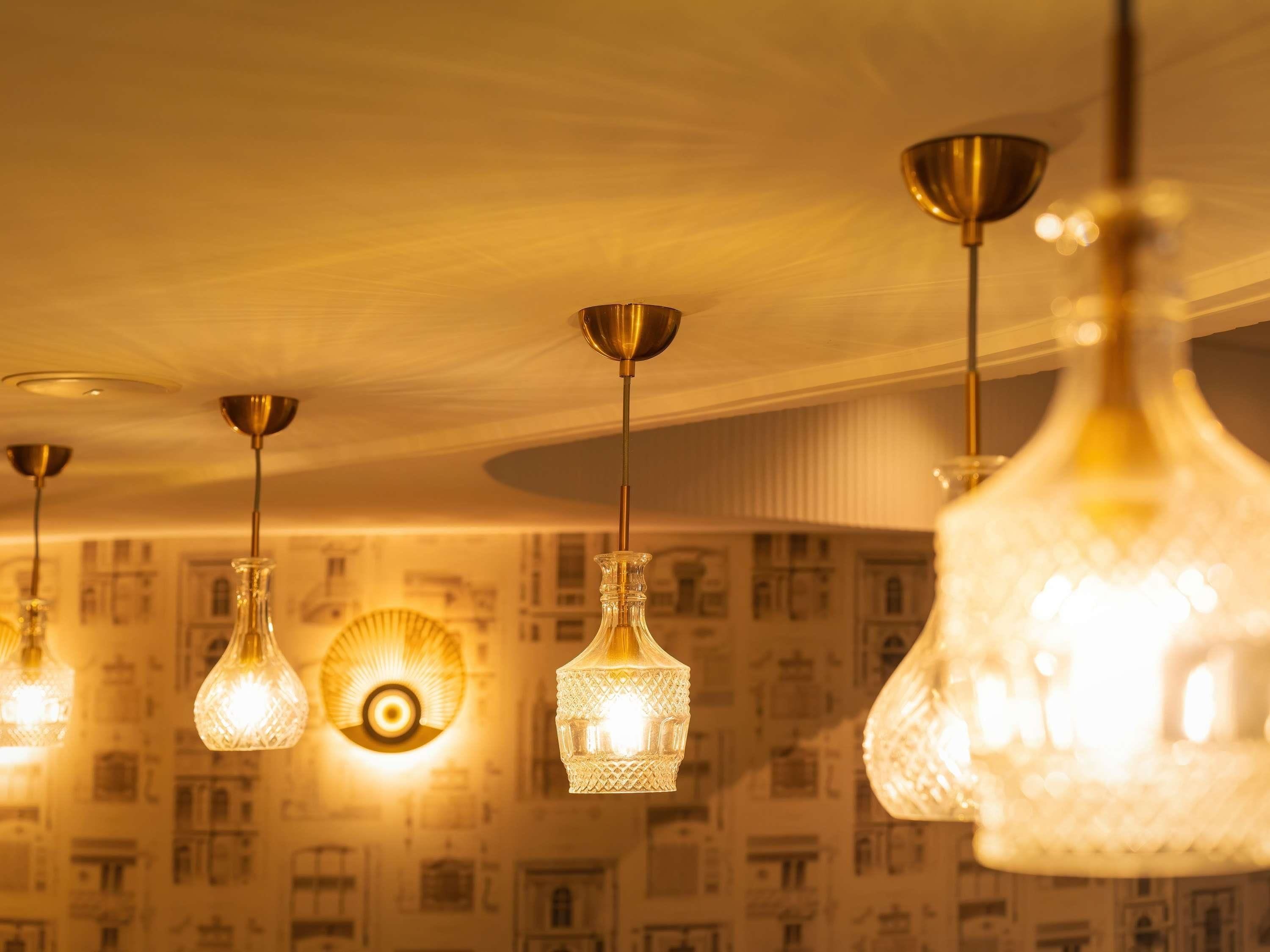 A ceiling with multiple hanging light fixtures.