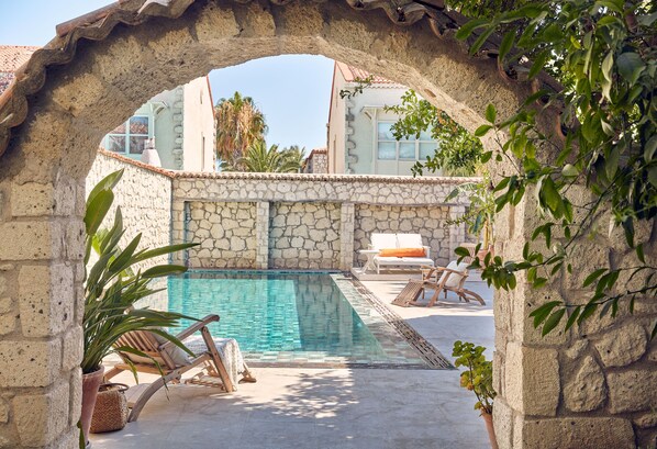 Outdoor pool, open 9:00 AM to 9:00 PM, pool umbrellas, pool loungers