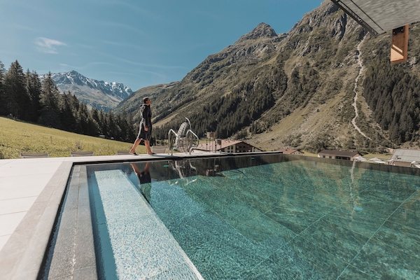 2 indoor pools, outdoor pool, open 11:00 AM to 7:00 PM, pool loungers