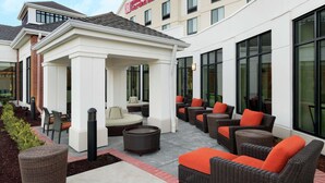 A hotel patio with outdoor seating and a gazebo. - Hilton Garden Inn Medford, OR  (Medford)