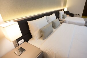 Deluxe Triple Room, Balcony | Minibar, in-room safe, desk, blackout curtains
