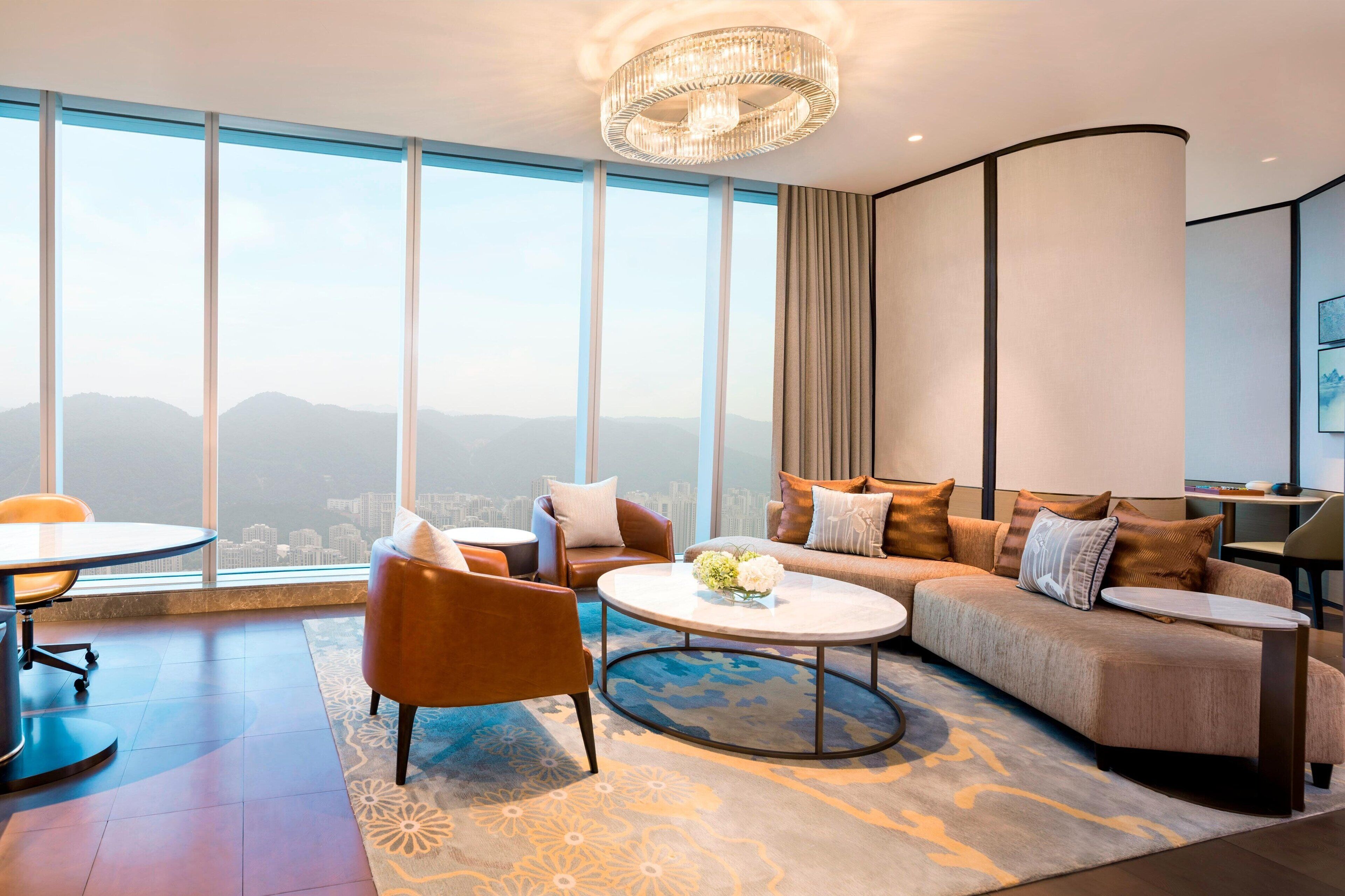 premier suite, 1 king bed, lake view | living room | lcd tv, books