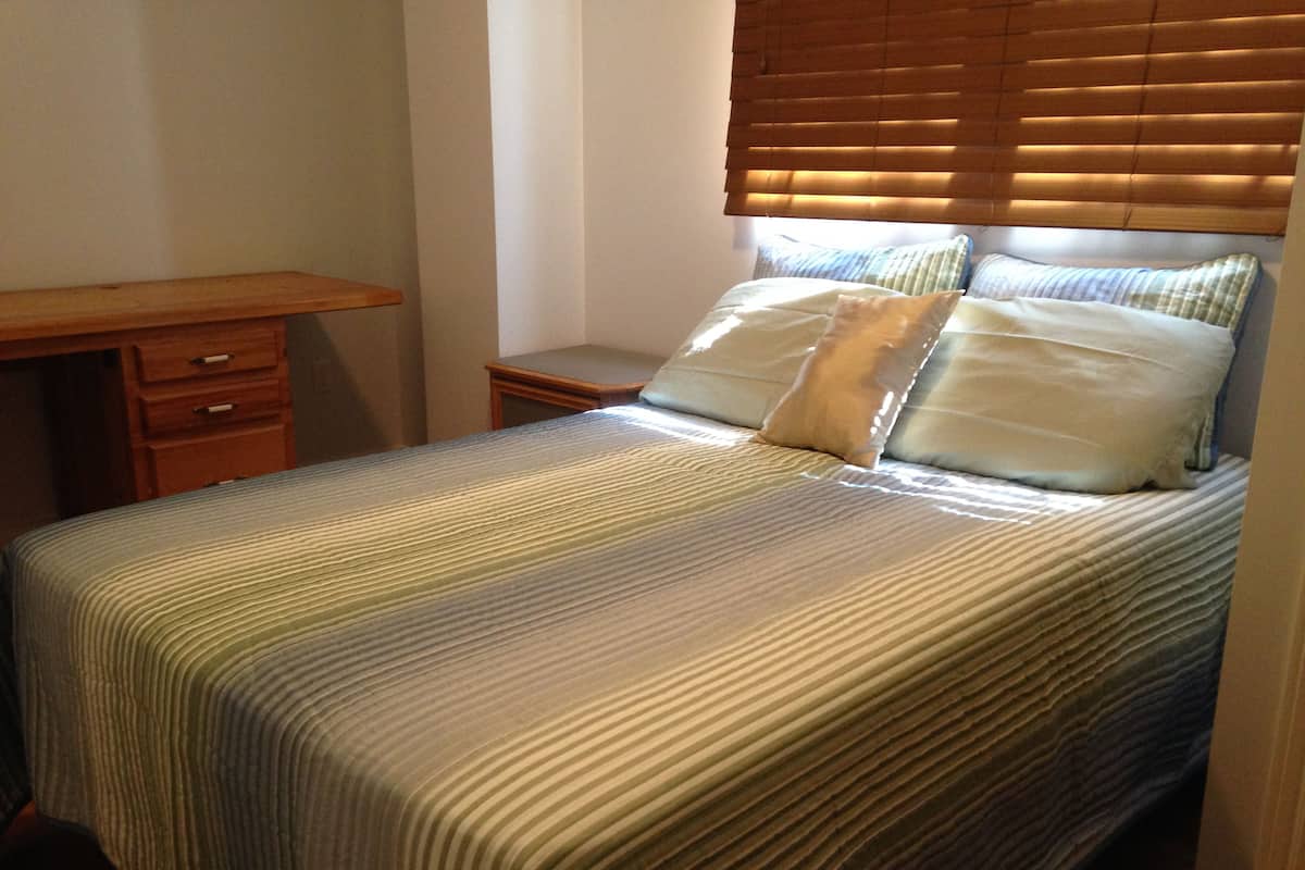 Economy Room, 1 Queen Bed | Desk, laptop workspace, bed sheets