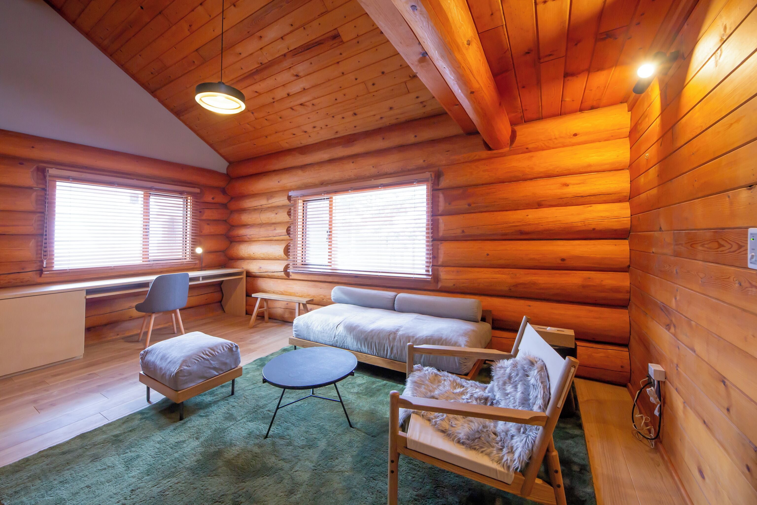 deluxe room | living area | flat-screen tv, heated floors