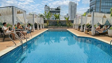 Outdoor pool, open 6:00 AM to 9:30 PM, pool umbrellas, pool loungers