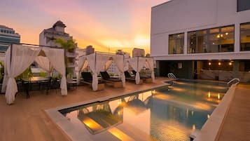 Outdoor pool, open 6:00 AM to 9:30 PM, pool umbrellas, pool loungers