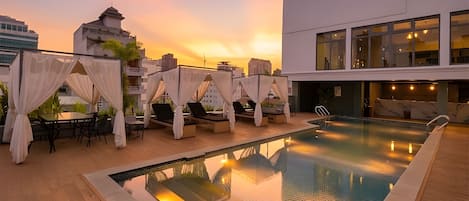 Outdoor pool, open 6:00 AM to 9:30 PM, pool umbrellas, pool loungers