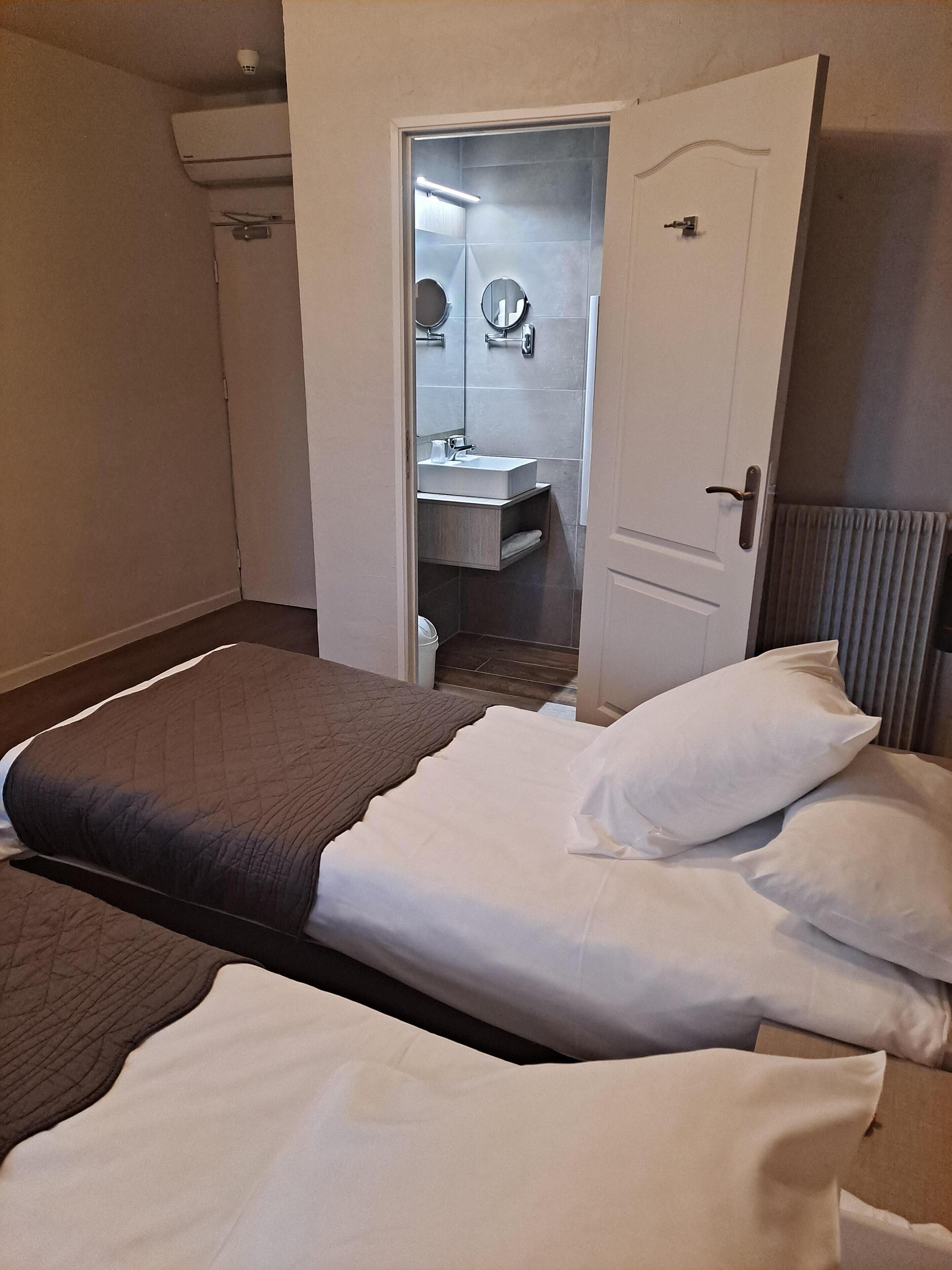 classic twin room | premium bedding, in-room safe, desk, laptop workspace