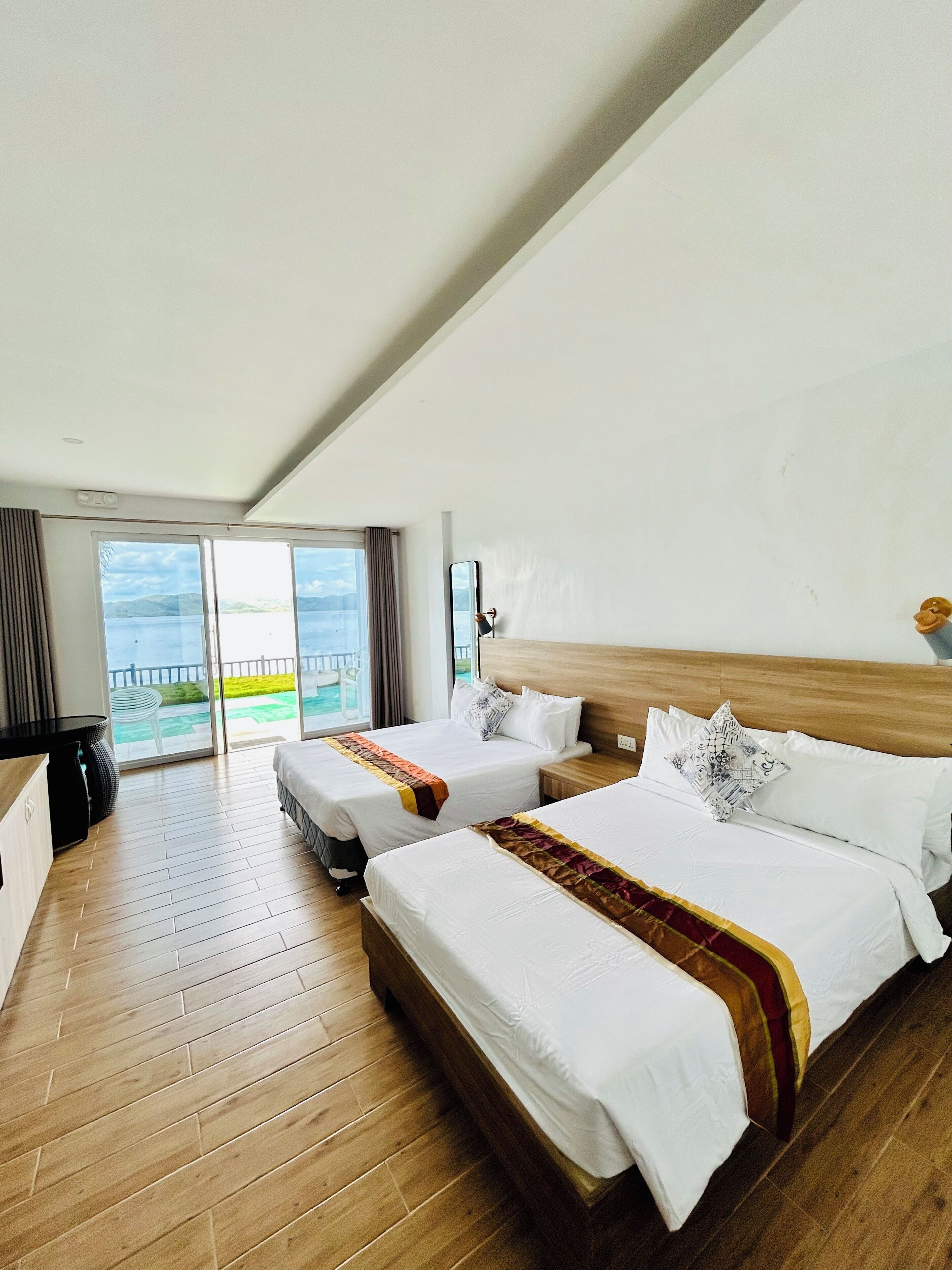Standard Triple Room, Bay View | Blackout drapes, soundproofing, bed sheets