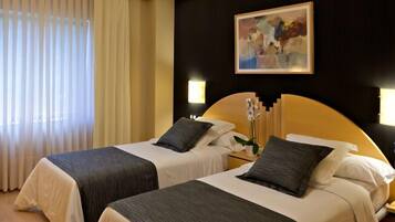 Egyptian cotton sheets, down comforters, desk, blackout drapes