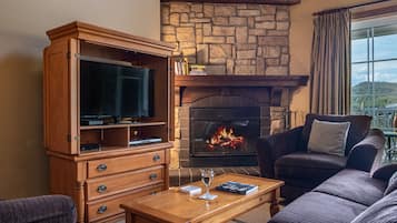 Manoirs 120-4 | Living room | 45-inch flat-screen TV with satellite channels, TV, fireplace