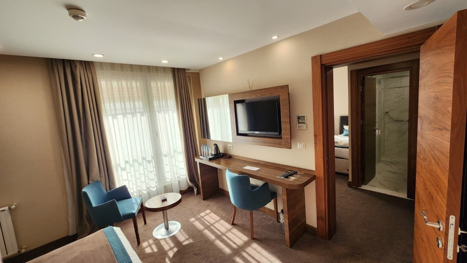 Deluxe Suite, 2 Bedrooms | Minibar, in-room safe, desk, laptop workspace
