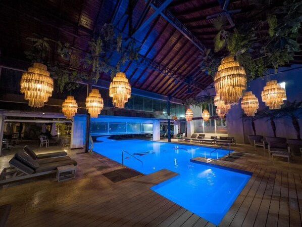 Indoor pool, outdoor pool, pool umbrellas, pool loungers
