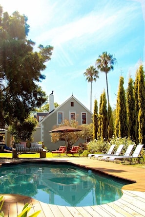 Outdoor pool, open 7:00 AM to 8:00 PM, pool umbrellas, pool loungers