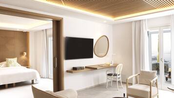Una habitación de hotel moderna con una cama, un sofá, una silla, un televisor y un ventanal grande.