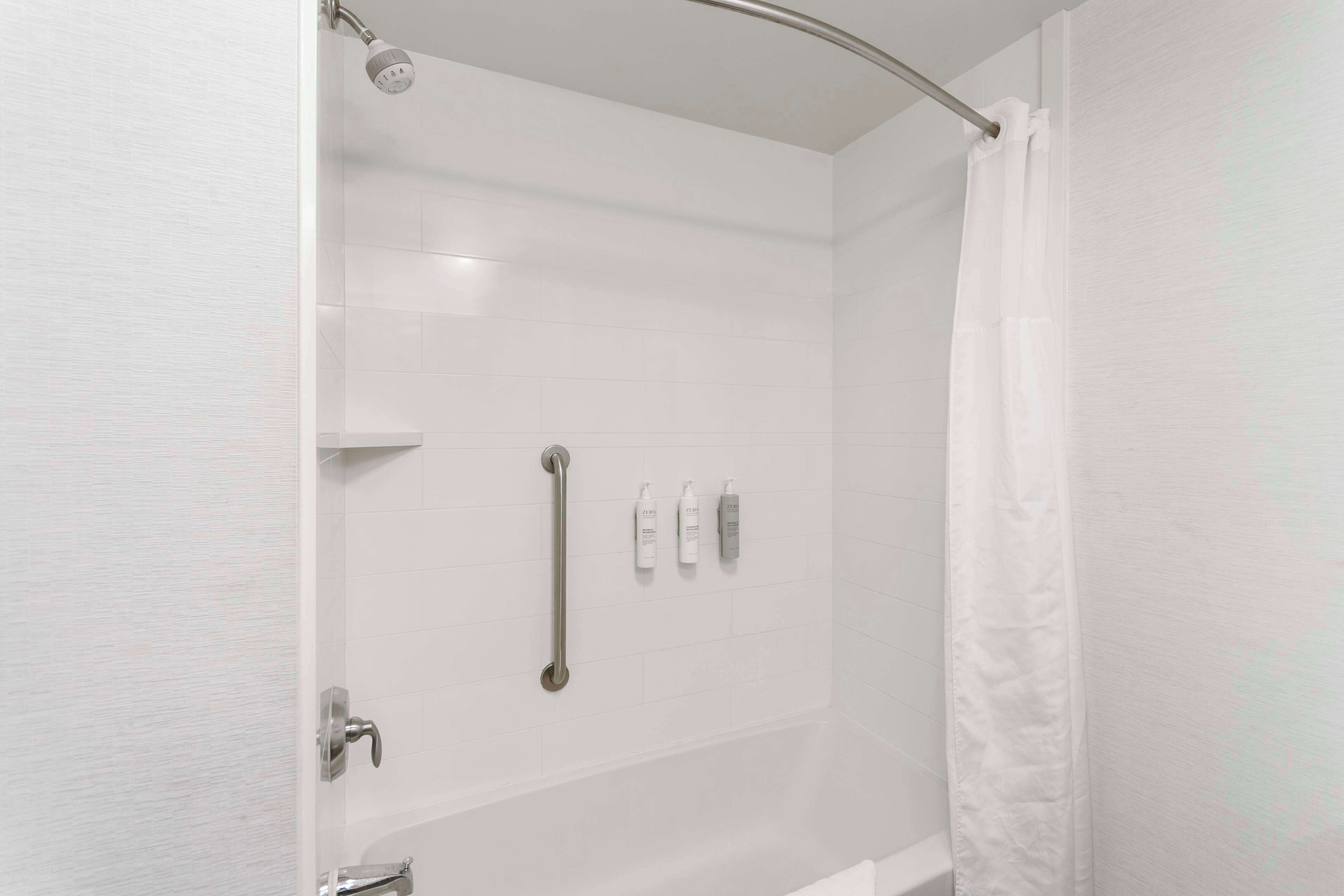 room, multiple beds | bathroom shower