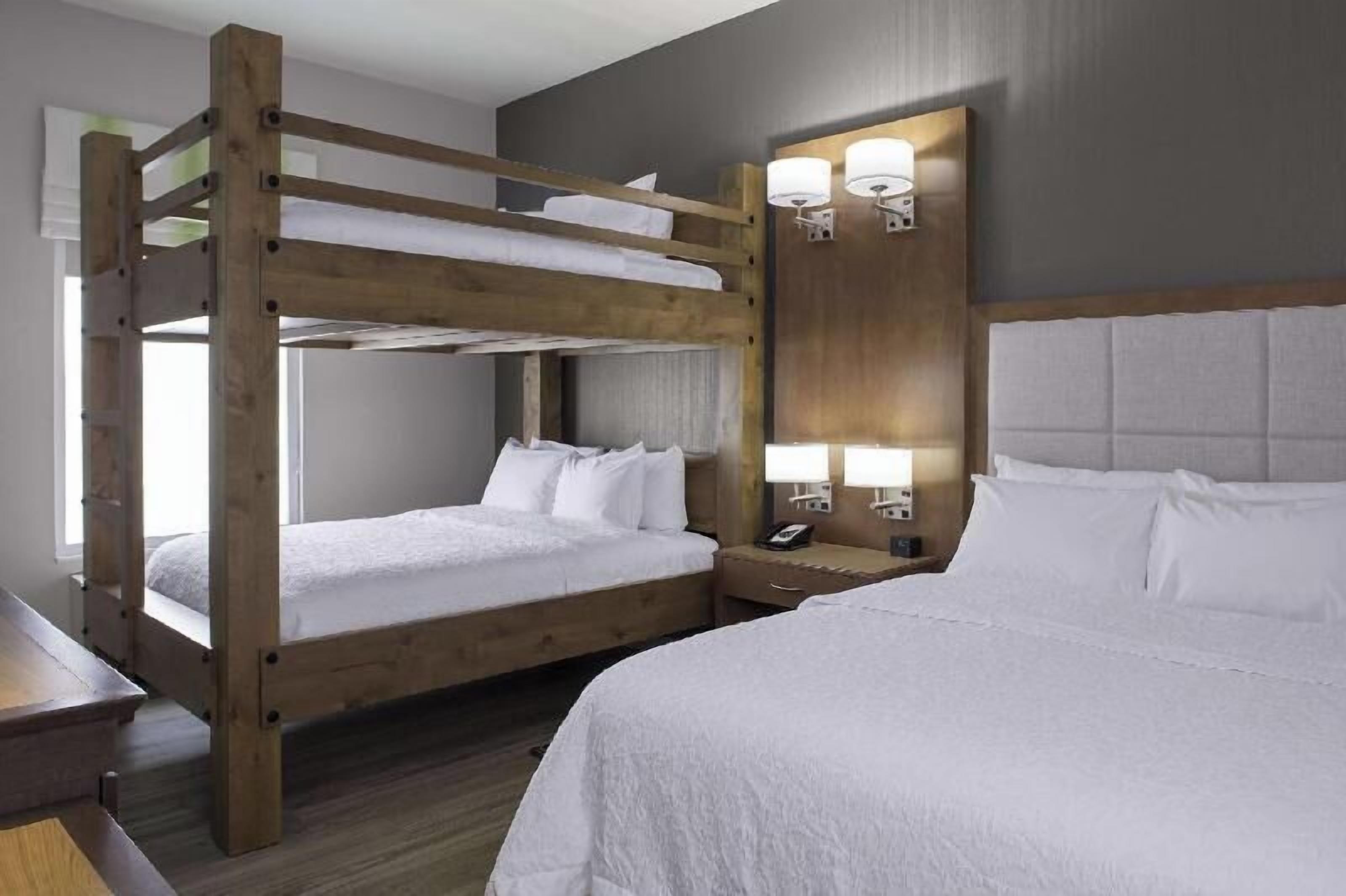 Desk, laptop workspace, blackout drapes, iron/ironing board