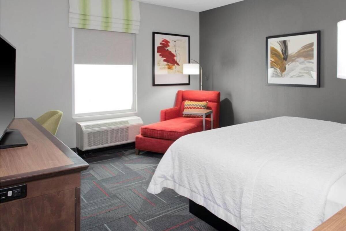 Desk, laptop workspace, blackout drapes, iron/ironing board