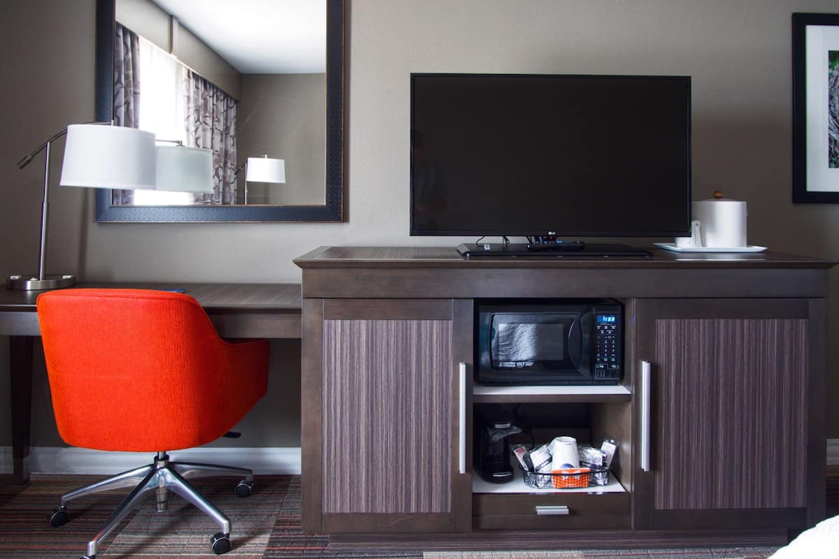 desk, laptop workspace, blackout curtains, iron/ironing board