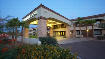 Experience a welcoming atmosphere at Premier Inns, with a prominent entrance and beautifully landscaped surroundings.