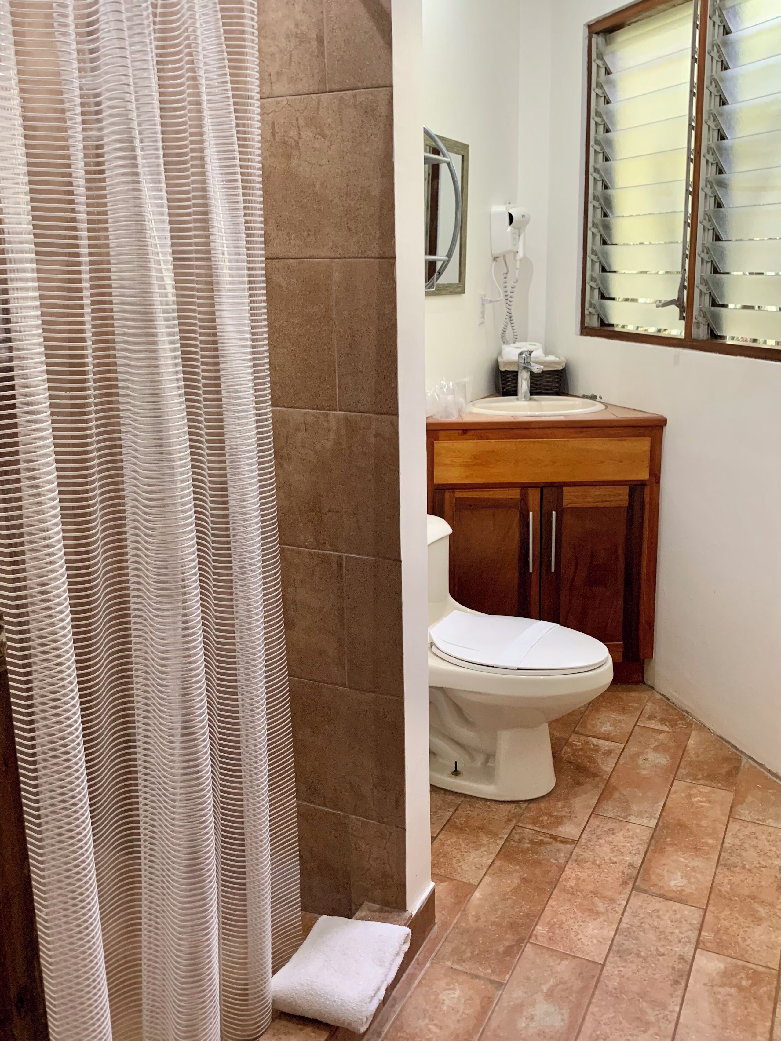 superior double room, garden view | bathroom | shower, rainfall showerhead, towels