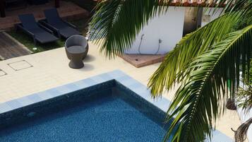 Outdoor pool, open 9:00 AM to 9:00 PM, pool umbrellas, pool loungers