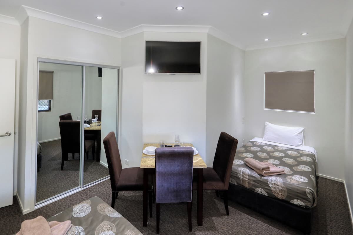 Family Room Upstairs | Premium bedding, desk, soundproofing, iron/ironing board