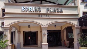 A hotel entrance with a sign reading 'SPRING PLAZA HOTEL.' - Spring Plaza Hotel (Dasmarinas)