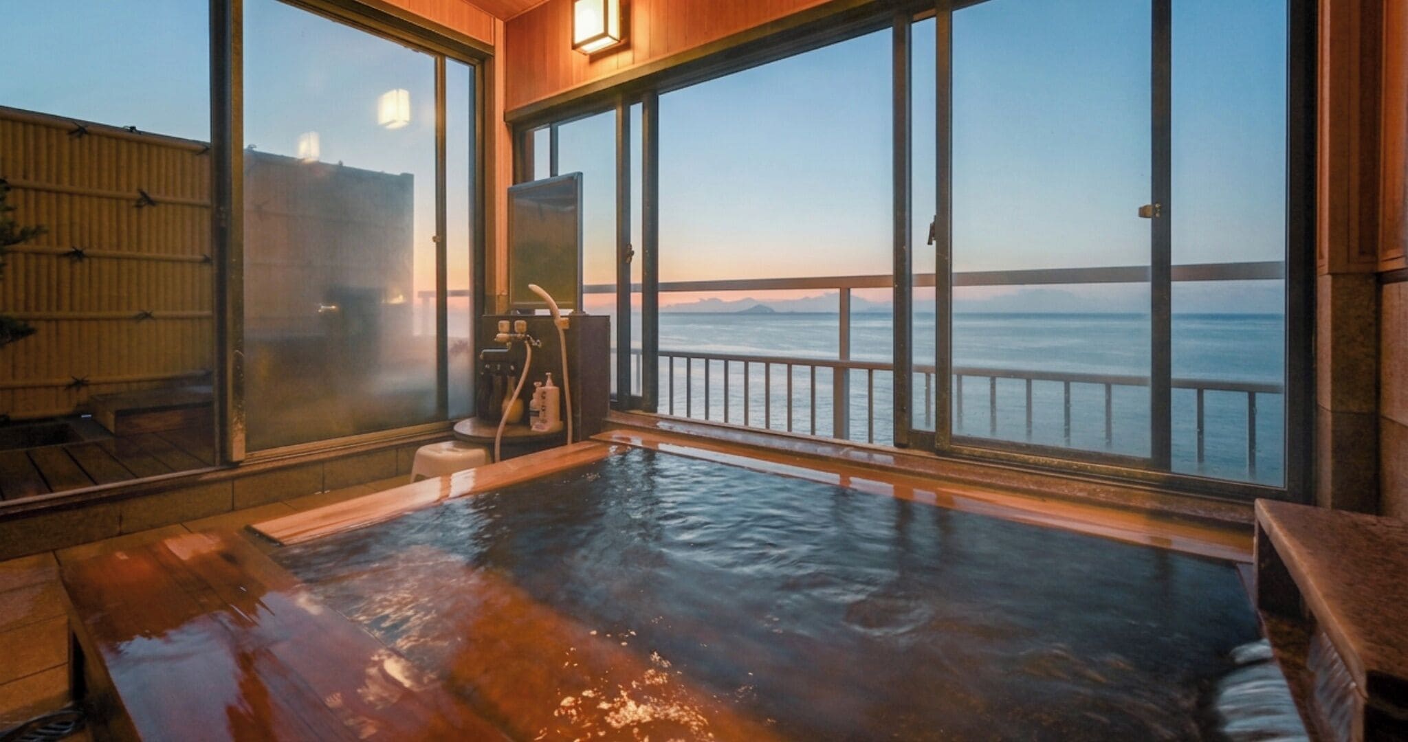 A hot tub with a view of the ocean.
