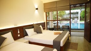 A hotel room with two beds, a large window with a view of a swimming pool, and a sliding glass door leading to an outdoor area. - Fort Edge Retreat (Unawatuna)