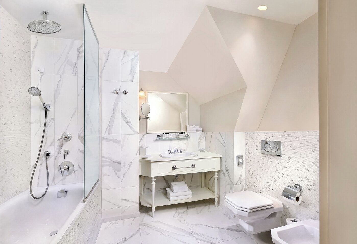 A modern bathroom with a shower, toilet, sink, and vanity.