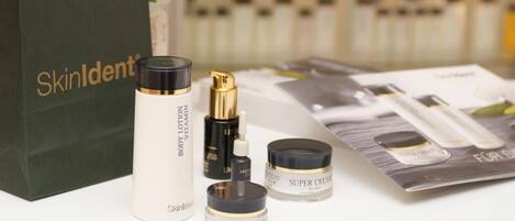 A skincare product display with items like body lotion, eye care, and super cream.