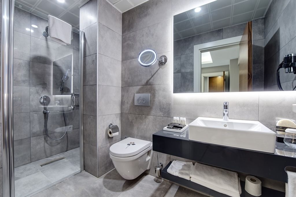 superior triple room | bathroom | shower, free toiletries, hair dryer, bathrobes