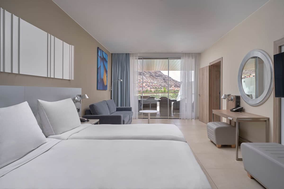 Suite, 2 Bedrooms, Balcony, Pool View | Premium bedding, minibar, in-room safe, desk