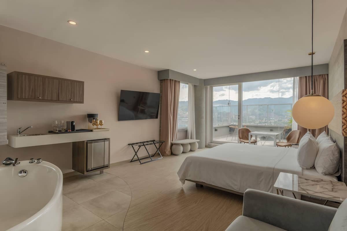 Suite, 1 King Bed, Non Smoking, Balcony (Efficiency) | Premium bedding, in-room safe, individually decorated, soundproofing