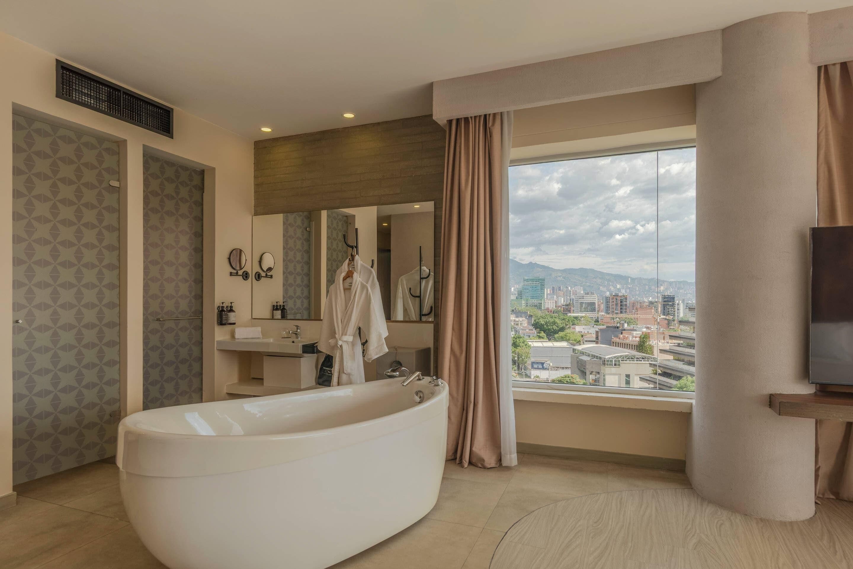 Suite, 1 King Bed, City View | Premium bedding, in-room safe, individually decorated, soundproofing