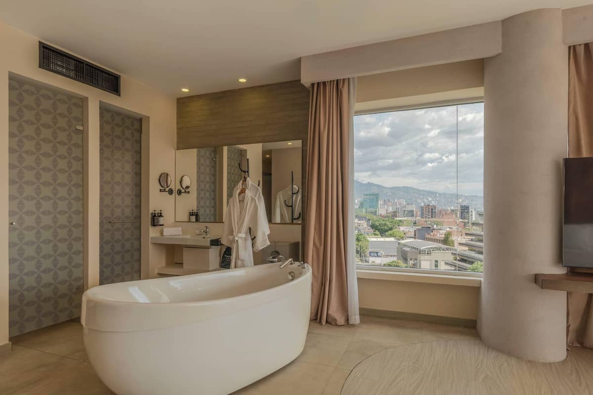 Suite, 1 King Bed, City View | Premium bedding, in-room safe, individually decorated, soundproofing