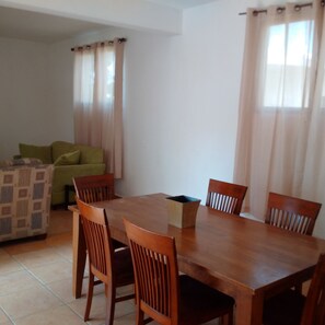 Classic Apartment, 2 Bedrooms, Balcony | Living area | 32-inch TV with cable channels - Gabrielle’s (Port-au-Prince)