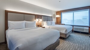 A hotel room with two beds, a large window, and a modern design. - Holiday Inn Express & Suites Dallas North - Addison by IHG (Dallas)