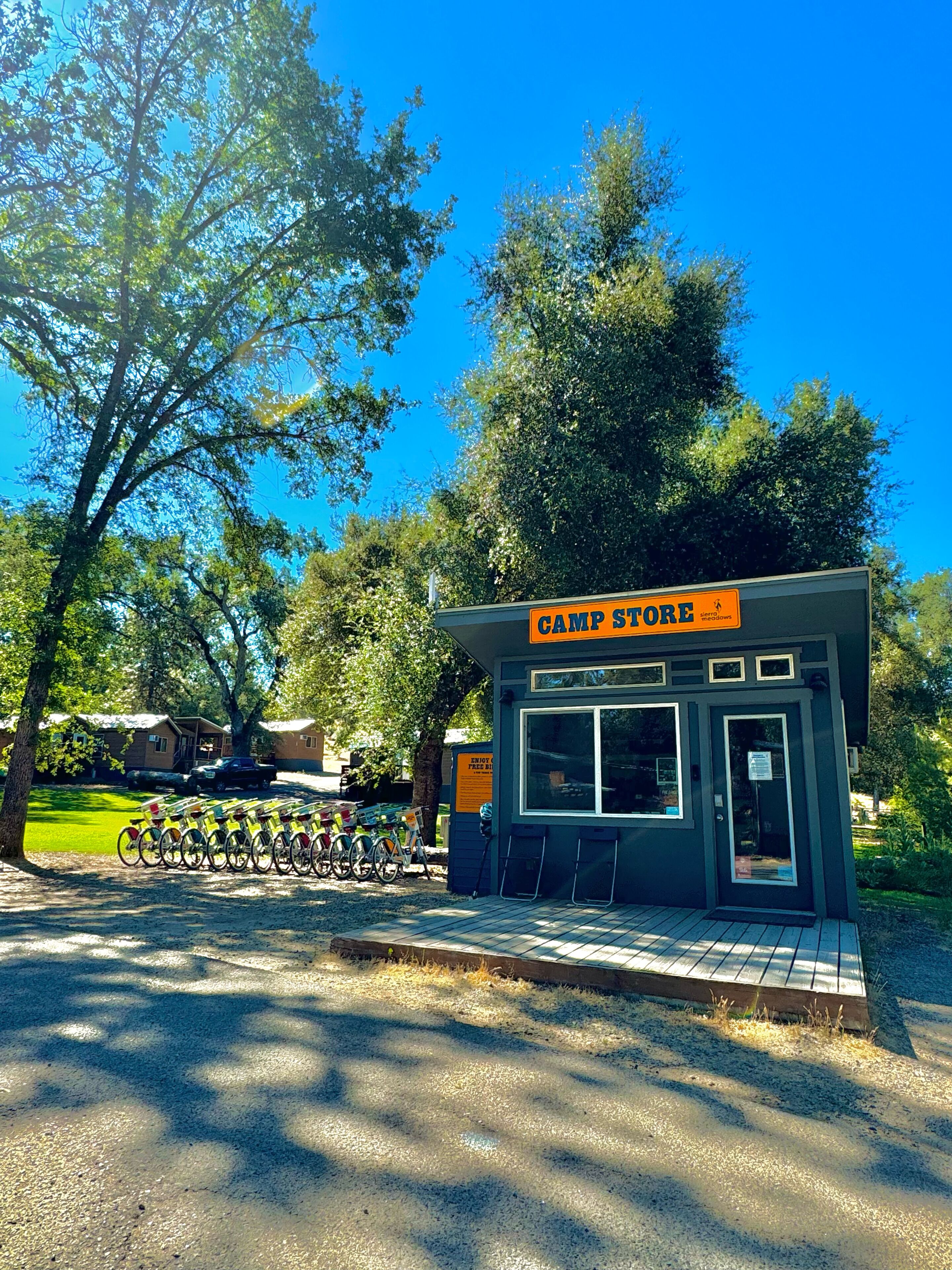 A small, single-story building labeled "Camp Store" with a sign indicating "Enjoy Free Wi-Fi."