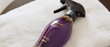 A bottle of fragrance on a white towel.
